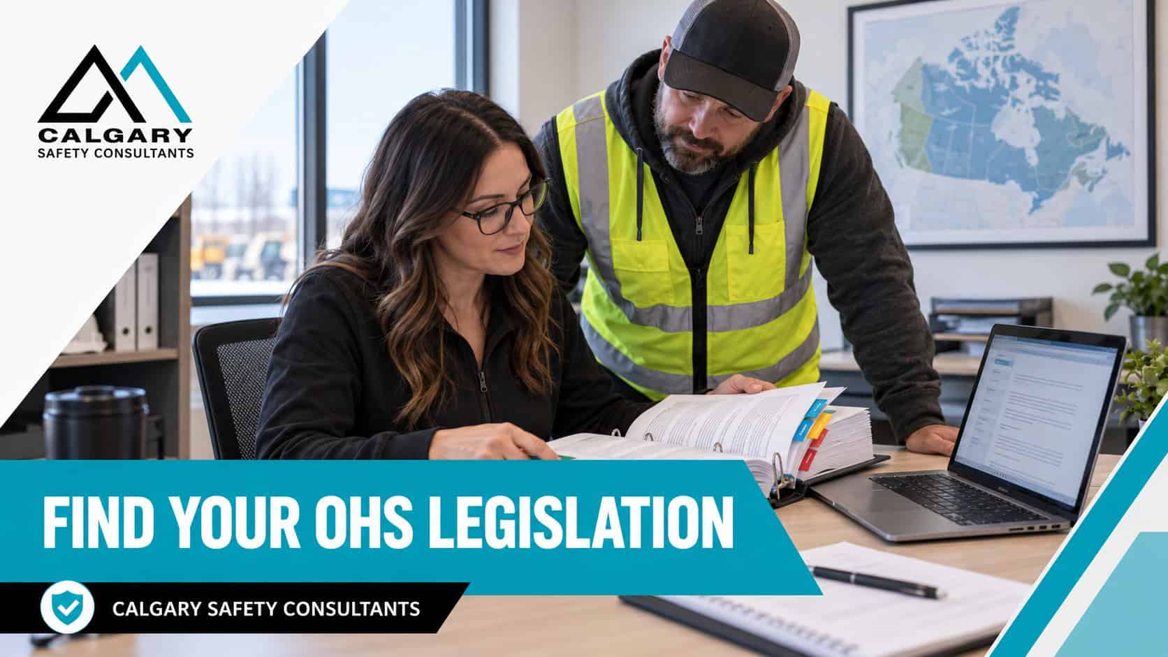 Find your OHS legislation: a safety coordinator and a supervisor reviewing a tabbed occupational health and safety legislation binder, with a map of Canada on the wall